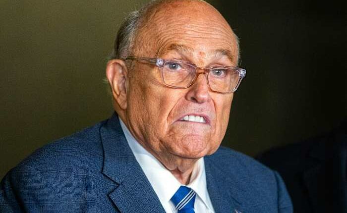 Rudy Giuliani leaves the hospital after being injured in a car crash in New Hampshire