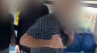 Shocking moment commuters are confronted by strangers in racial attack