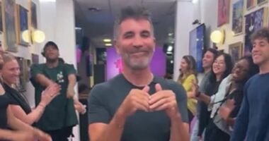 Simon Cowell insists he 'absolutely loved' doing the 'spirit tunnel'