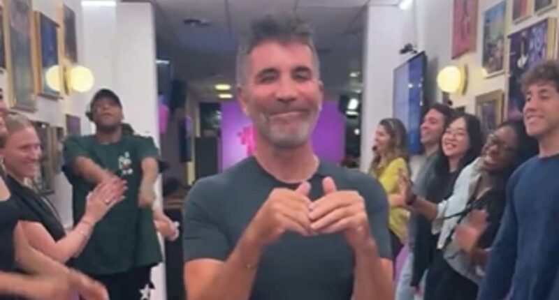 Simon Cowell insists he 'absolutely loved' doing the 'spirit tunnel'