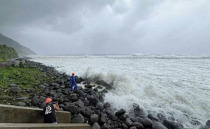 Super typhoon blowing by northern Philippines and Taiwan forces evacuations and closures