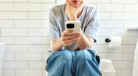 The seven health reasons why to stop using your phone on the loo