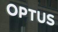 A close-up shot of an Optus store sign