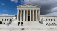 Trump says US would be on 'brink of economic catastrophe' unless justices rule his tariffs are legal