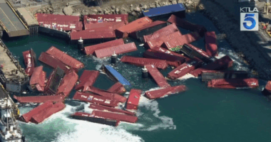 Video: Dozens of cargo containers spill into California port