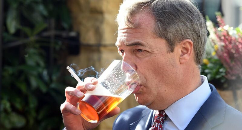 Controversial UK politician Nigel Farage slams Australia's smoking bans for causing rise of criminal gangs as he puffs on a dart outside a pub