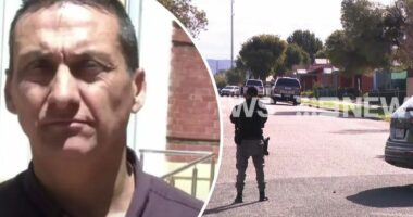 Cops swarm quiet street in manhunt for accused cop killer