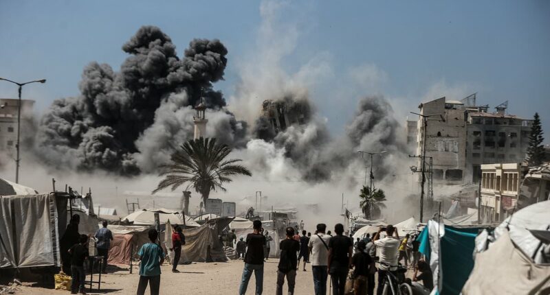 Israel says it is 'opening the gates of Hell' in Gaza as IDF blows up tower block 'used by Hamas terrorists'