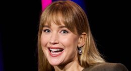 Jennifer Lawrence turns heads in a quirky cut-out gown as she accepts award at San Sebastian Film Festival - after fans turn on the star over her stance on Palestine