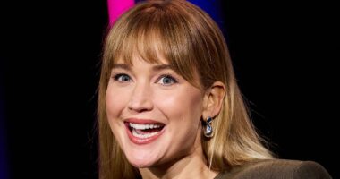 Jennifer Lawrence turns heads in a quirky cut-out gown as she accepts award at San Sebastian Film Festival - after fans turn on the star over her stance on Palestine