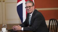 Keir Starmer vows to 'never surrender' the Union Jack to those sowing 'violence, fear and division' after more than 100,000 take part in violent Tommy Robinson demo