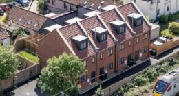 The village at war over £300K townhouses for asylum seekers: Furious residents 'were kept in the dark about new arrivals' and fear homes were purposely built for migrants