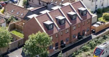 The village at war over £300K townhouses for asylum seekers: Furious residents 'were kept in the dark about new arrivals' and fear homes were purposely built for migrants