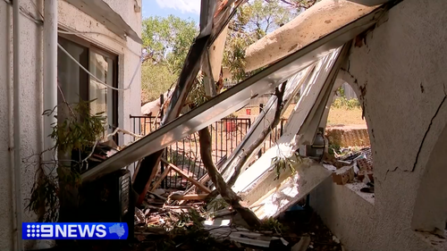 'It's just horrific': Huge gum tree crashes through home in wild storm