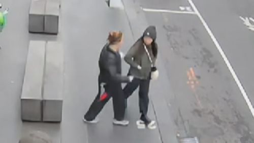 CCTV footage has shown the moment a woman was randomly stabbed in broad daylight while walking to work at a sushi restaurant in Melbourne's CBD. ï»¿