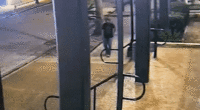 gif of surveillance footage where man is walking through street