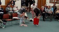Activists strip to protest trans athletes at school board meeting