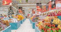 Christmas decorations line a supermarket.