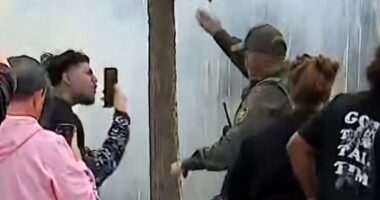 Armed federal agents clash with crowd in Chicago