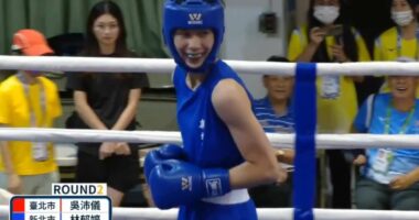 Astonishing moment gender-row boxer smirks as opponent throws in towel