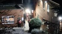 Asylum hotel residents fight, throw rocks and try to climb wall