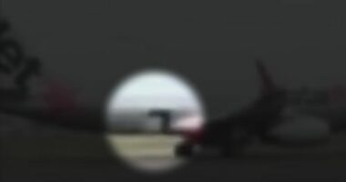 Footage shows the moment a Jetstar flight began taxiing with a cargo door wide open.