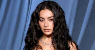 Charli XCX stuns in dramatic lace and leather gown