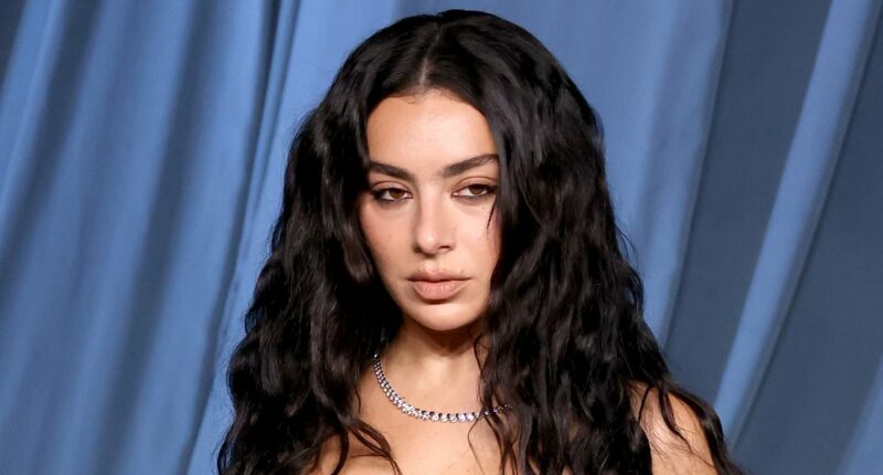 Charli XCX stuns in dramatic lace and leather gown