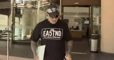 Cops label bikie 'middle-aged man playing dress-ups' over Nazi tat charge
