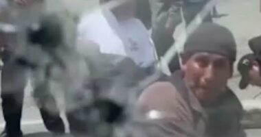 Crowd attacks Ecuadorian president's car with rocks
