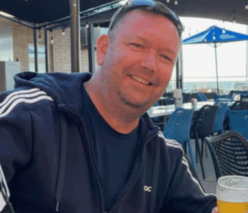 Chris Robertson has been identified as the 49-year-old found dead at a workshop on O'Sullivan's Beach Road in Lonsdale, an industrial suburb in Adelaide, yesterday.