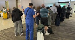 Passengers seek updates on their delayed flight at Louis Armstrong New Orleans International Airport, Aug. 6, 2025, in Kenner, La. (Jack Brooks, Associated Press)