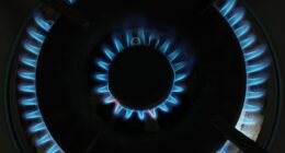 A gas flame burns on a gas stove top on August 19, 2022.