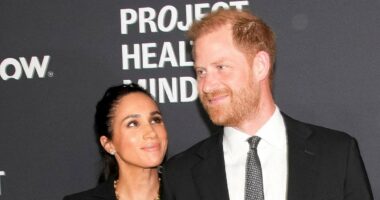 Harry and Meghan walk hand-in-hand as they arrive at glitzy ceremony