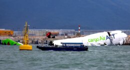 Hong Kong cargo plane skids off runway, killing two