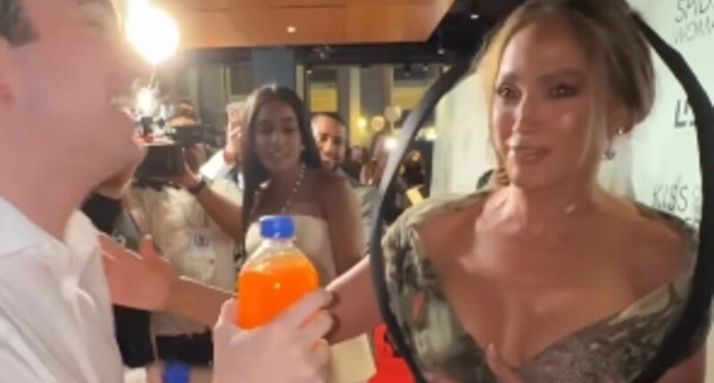 Jennifer Lopez screams she is 'scared' as fan jumps out