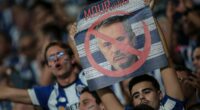 Jose Mourinho's return to Porto descends into CHAOS as objects are thrown at new Benfica boss and fights break out in the stands - days after warm Stamford Bridge welcome