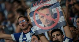 Jose Mourinho's return to Porto descends into CHAOS as objects are thrown at new Benfica boss and fights break out in the stands - days after warm Stamford Bridge welcome