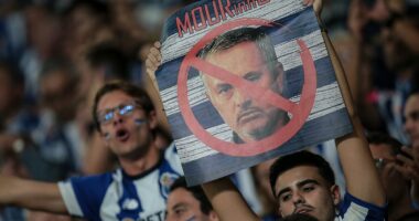 Jose Mourinho's return to Porto descends into CHAOS as objects are thrown at new Benfica boss and fights break out in the stands - days after warm Stamford Bridge welcome