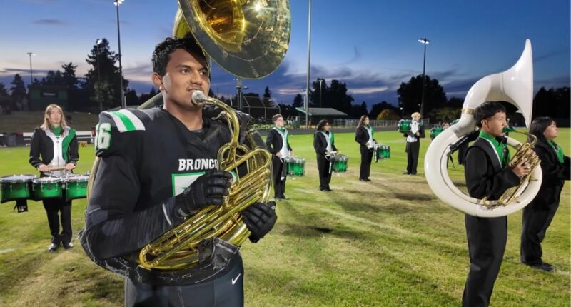 'Juni never gets a break': Football star with 4.0 GPA plays offense, defense, special teams — and tuba