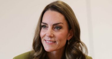 Kate is elegant in green suit as she joins children's play session