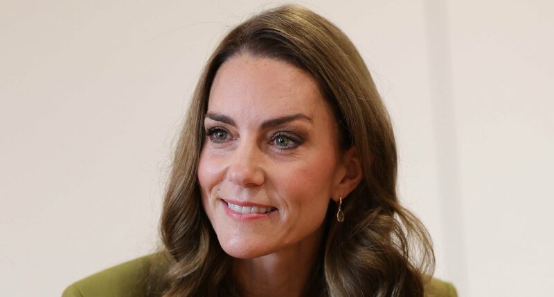 Kate is elegant in green suit as she joins children's play session