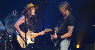 Keith Urban, 57, points to Maggie Baugh, 25, singing 'love' lyric