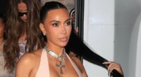 Kim Kardashian nearly spills out of VERY low-cut latex gown