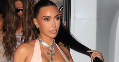 Kim Kardashian nearly spills out of VERY low-cut latex gown