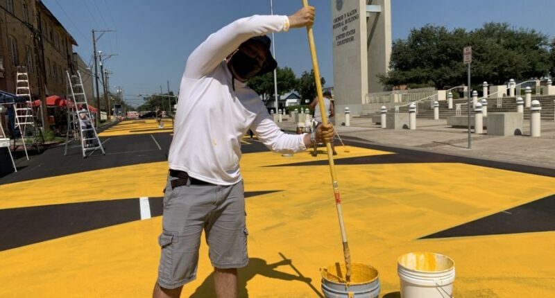 Laredo will remove anti-border-wall street mural after Abbott threatens to pull funding