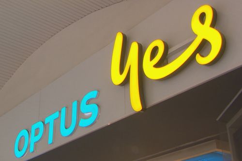 A low angle shot of the front of an Optus store sign.