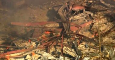 Debris covers the ground and vehicles after a powerful blast ripped through a military explosives manufacturing plant in Hickman County, Tennessee, on October 10.