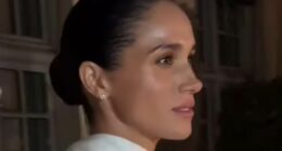 Meghan's own catwalk moment: Duchess of Sussex 'struts' as she leaves Balenciaga show in Paris
