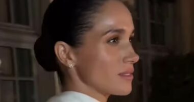 Meghan's own catwalk moment: Duchess of Sussex 'struts' as she leaves Balenciaga show in Paris